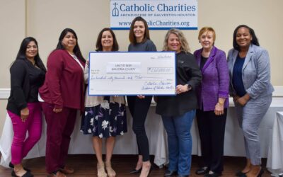 Catholic Charities Presents United Way of Brazoria County with Check for Mobile Home Repairs