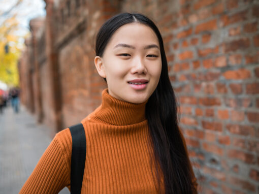 Portrait of young Asian woman in the street.