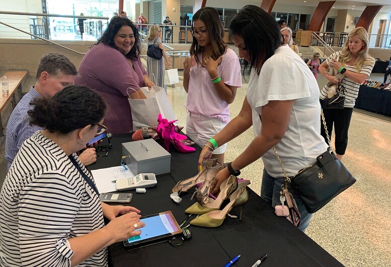 Houston-area fashionistas helped raise funds to support Catholic Charities' food pantries by shopping for shoes donated by SJP by Sarah Jessica Parker.
