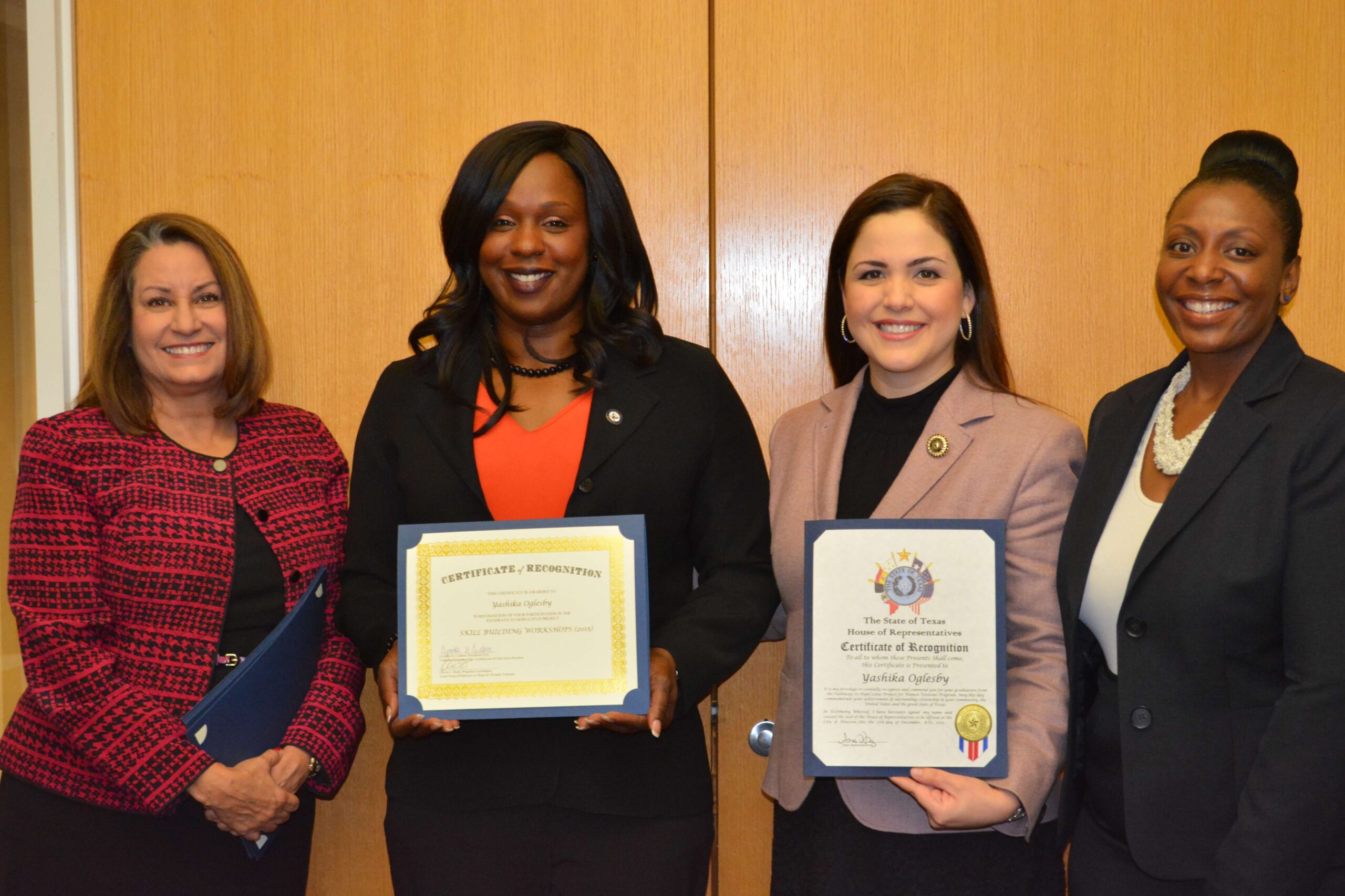 Yashika Olgesby (second from left) graduated from the Lotus Project program through Catholic Charities' Women Veteran Services. 