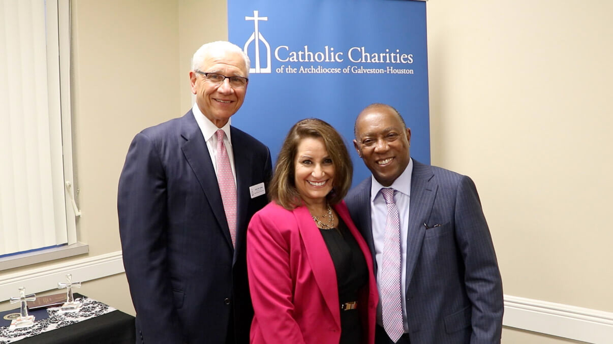 Catholic Charities Board of Directors Chairman John Kafka, President/CEO Cynthia N. Colbert and Houston Mayor Sylvester Turner at the Catholic Charities Annual Meeting.