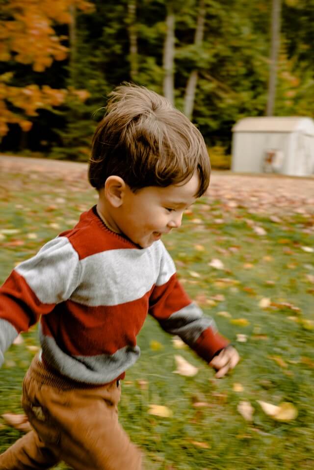 photo of toddler running on grass 3075061
